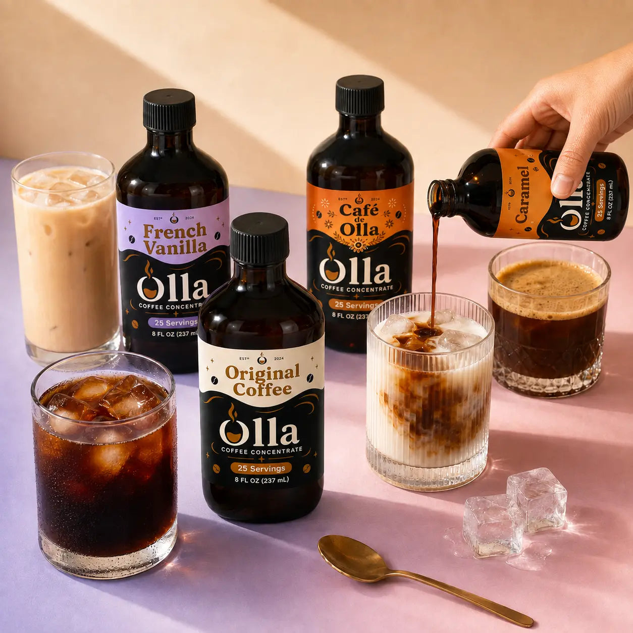 Four Olla Coffee Concentrate flavors with concentrate being poured into an iced latte